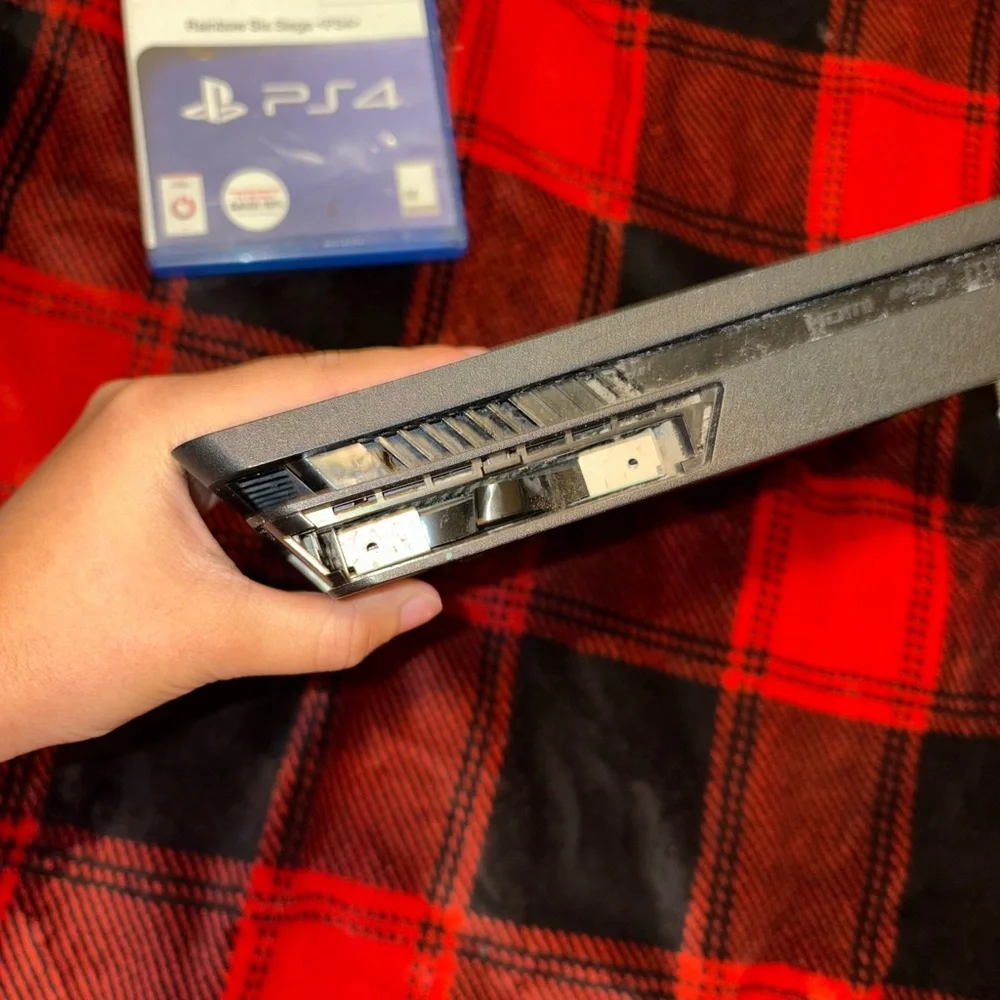 Sony PlayStation Console with Black and White Controllers